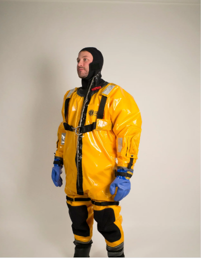Man wearing yellow and black Mustang IC9001 03 ICE Commander Rescue Suit
