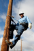 Man on pole wearing 3M DBI-SALA 1204076 Wood Pole Adjustable Web Fall Restricting Device Transmission Pole