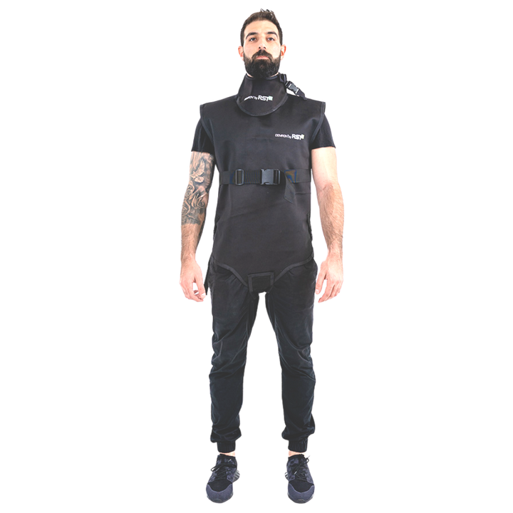 Man wearing black Radshield D2LVSO radiation vest against checkered background.